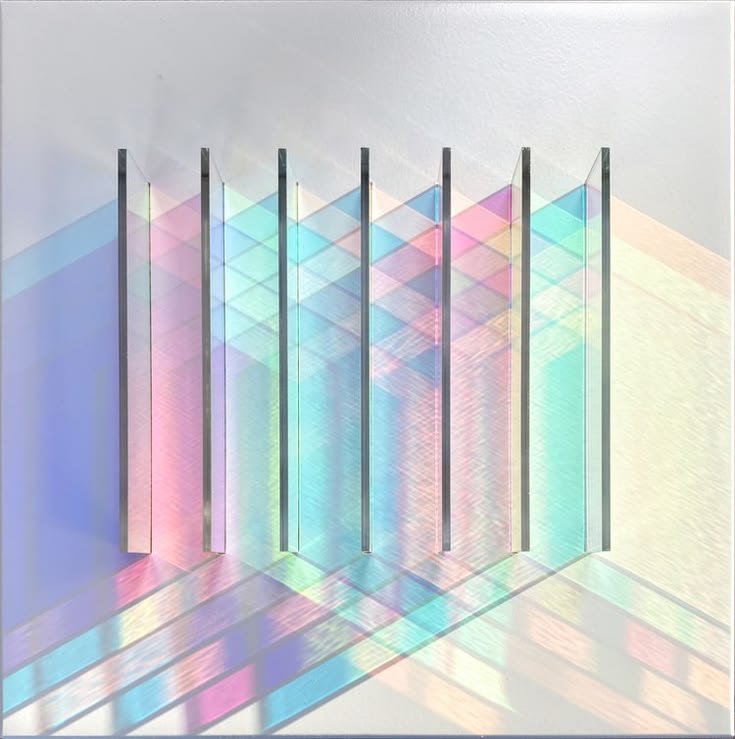 Collection of refracted light studies representing subtractive synthesis shaping a sound by removing frequencies